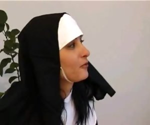 A nun gives some spanking to a naughty blonde